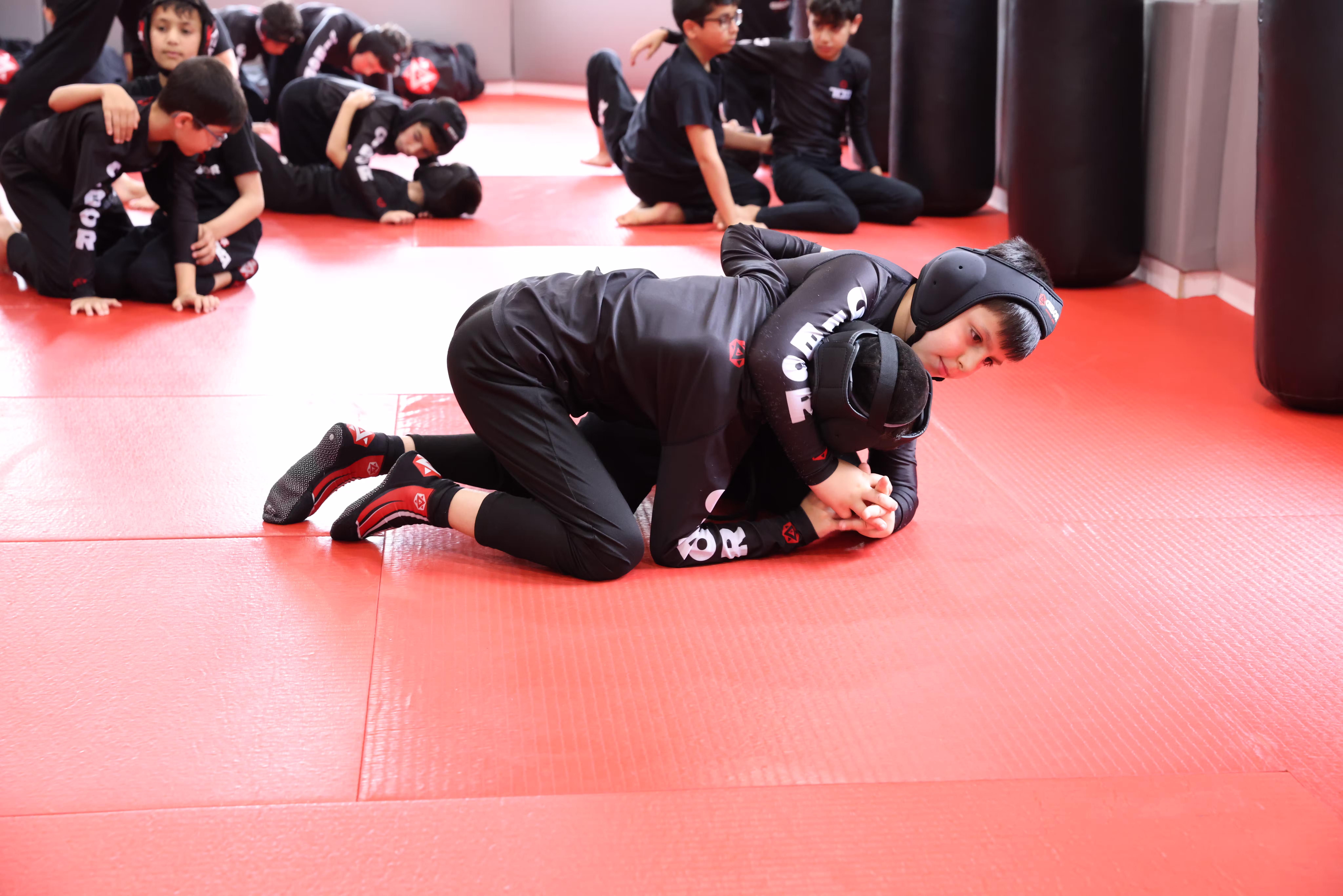 Kids jiu-jitsu students training at BeGibor